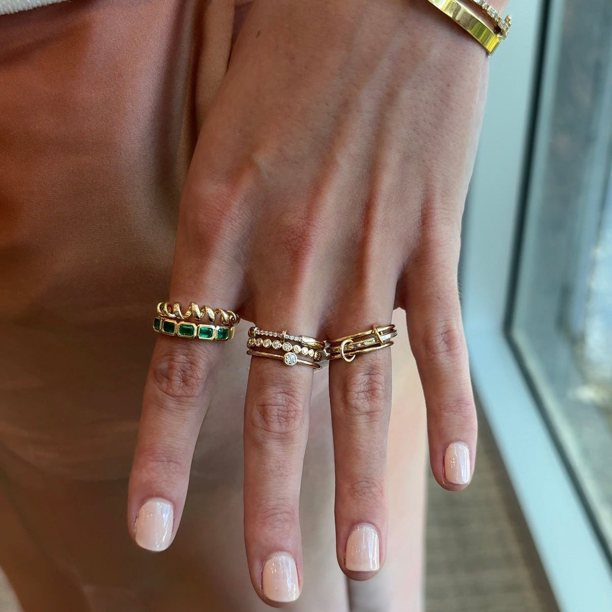 East-West Bezel Emerald Half-Band