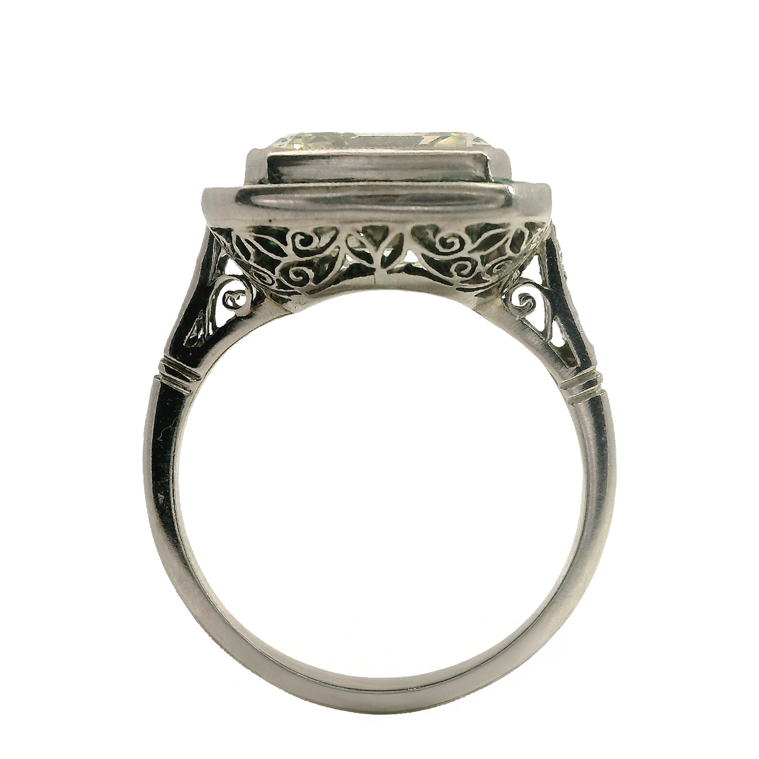 Vintage Emerald-Cut Diamond Ring with Emerald Halo